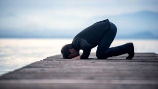 A man is offering prayer