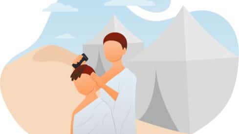 Two people in robes outside tents in a desert; one cutting the other's hair.