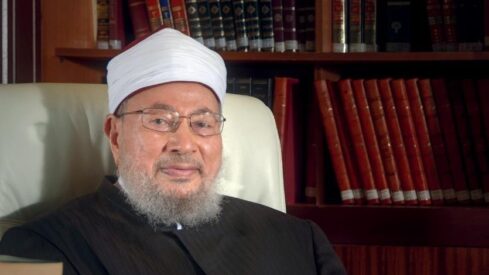 Yusuf Al-Qaradawi looking to camera 