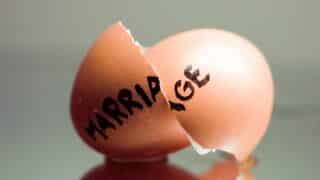 Broken eggshell with "marriage" written on it.