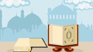 Open holy Quran on stand with intricate design, closed book beside, mosque silhouette background.