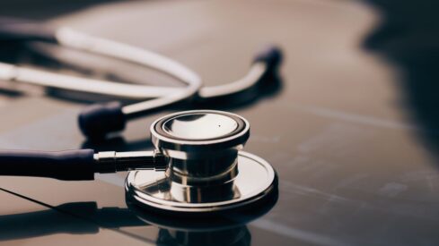 Stethoscope on desk represents medical innovation and healthcare advancements